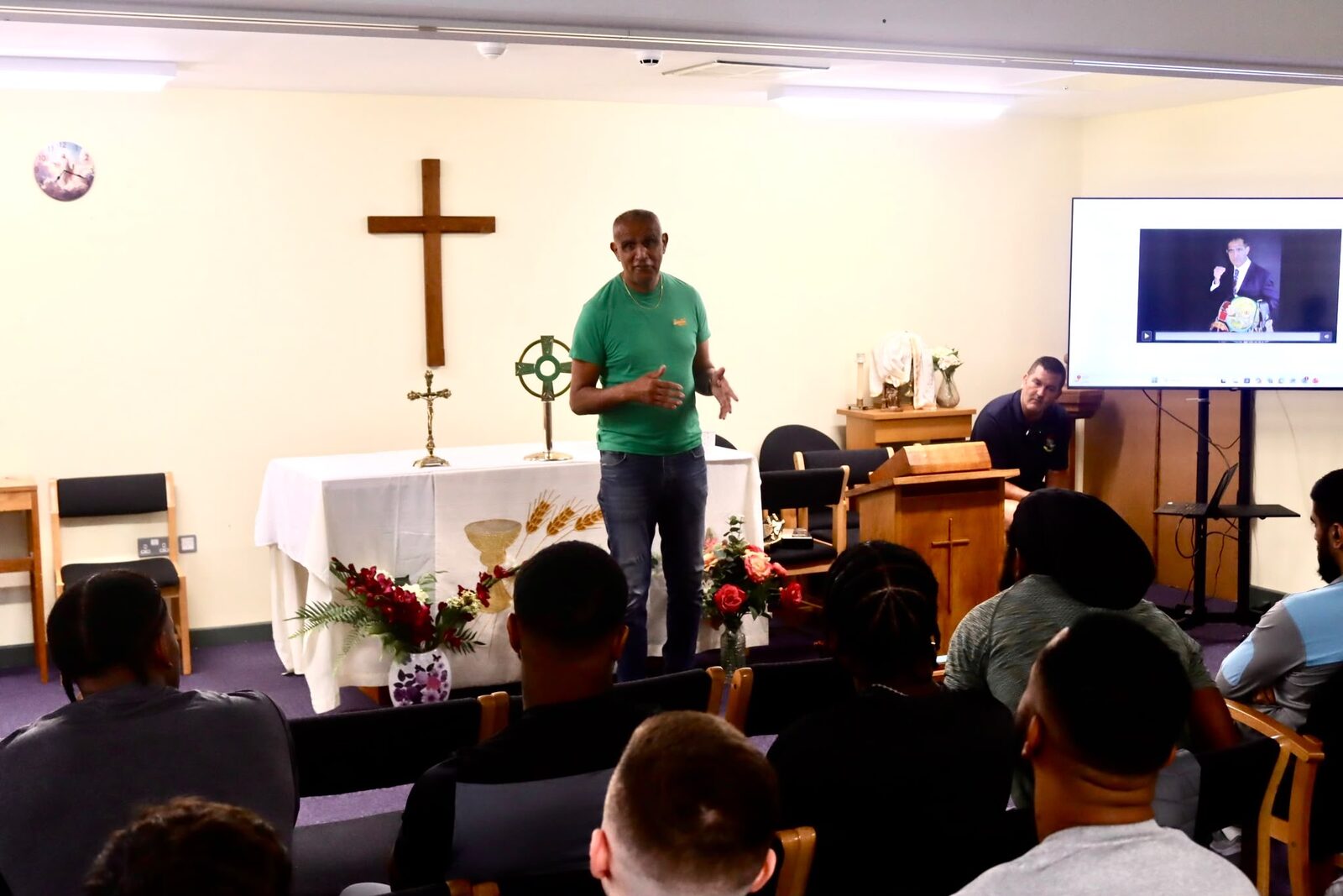 Kash speaking to an audience
